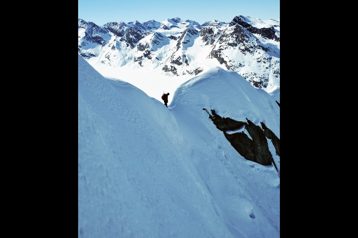 About to drop in, snowboarding the Chugach Mountains out of Valdez, doing a glacier ski camp.