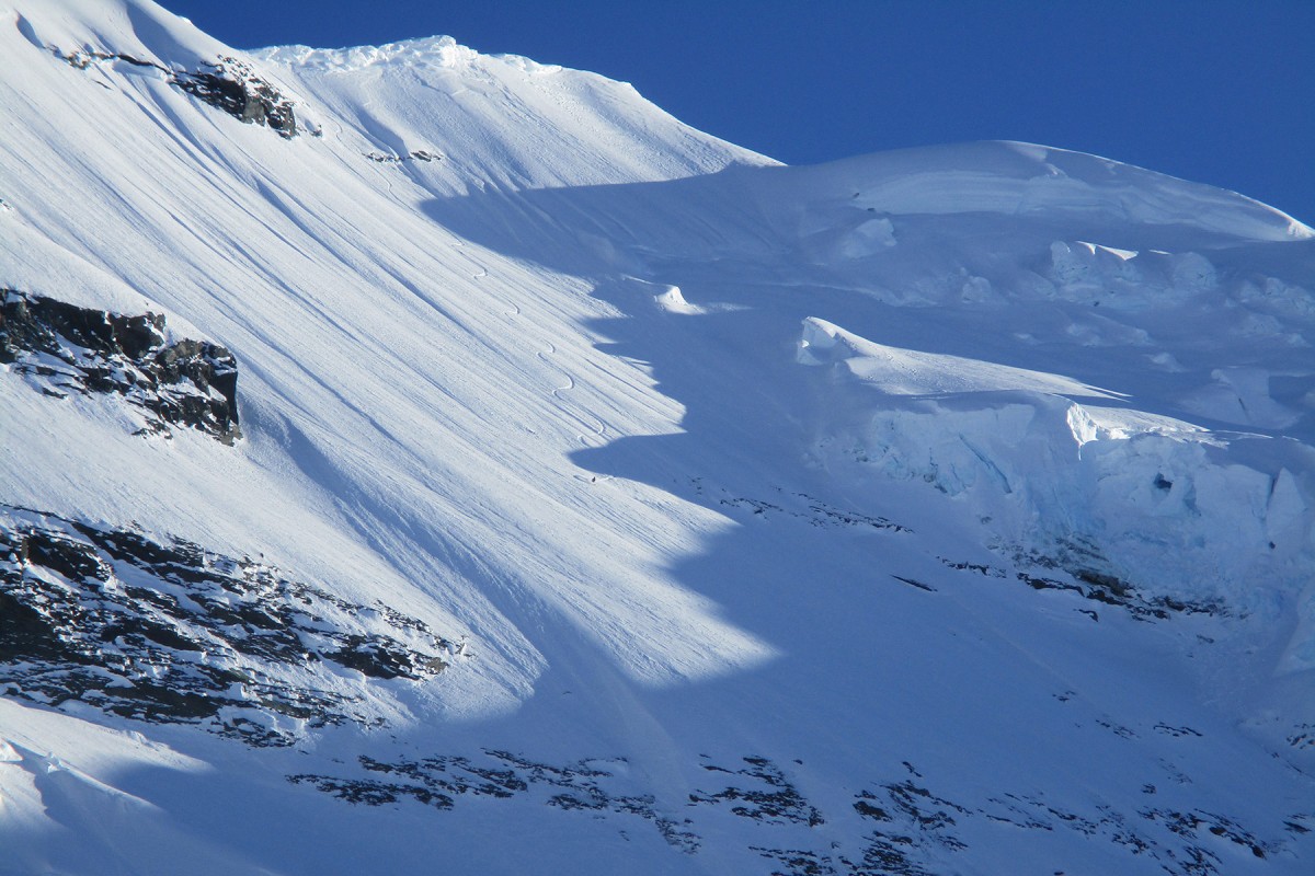 Carving lines riding down the Chugach from the Here He Comes ski camp near Valdez.